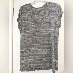 Gray v-neck stretchy t-shirt. Soft A-line form fitting shirt.